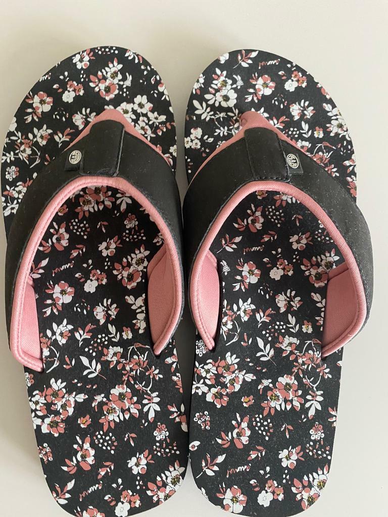 black animal flip flops